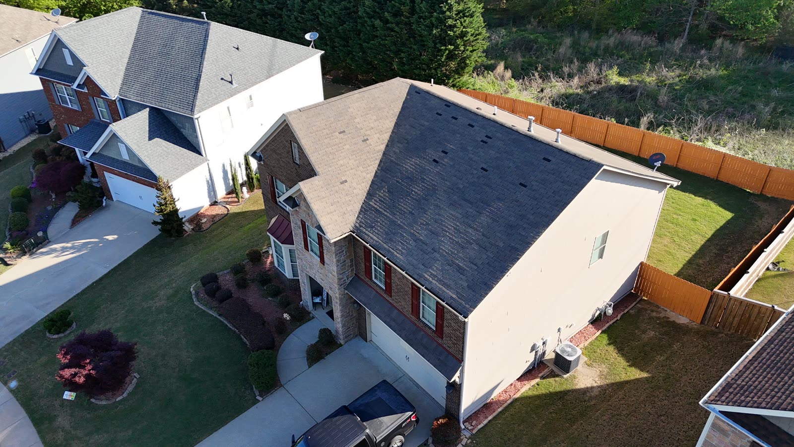 Before: storm-damaged roof in Buford, GA with missing shingles